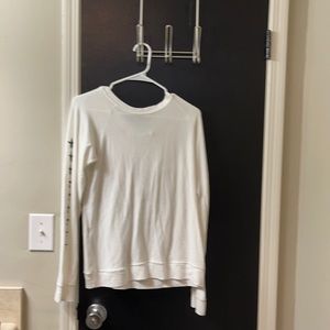 White long sleeve shirt with black stars